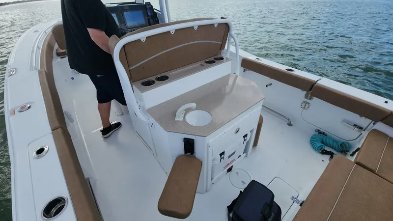 Slide: The Image of 2024 Sea Hunt Ultra 275 SE boat interior with seating and control panel. - 28