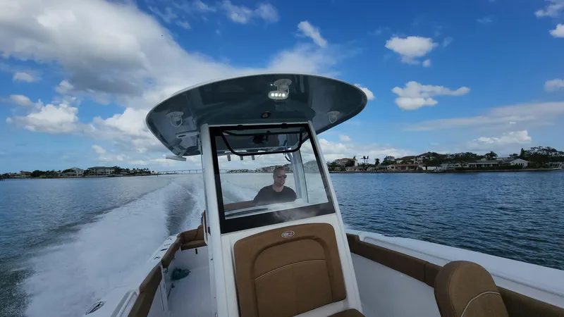 Slide: The Image of 2024 Sea Hunt Ultra 275 SE cruising on a sunny day. - 3