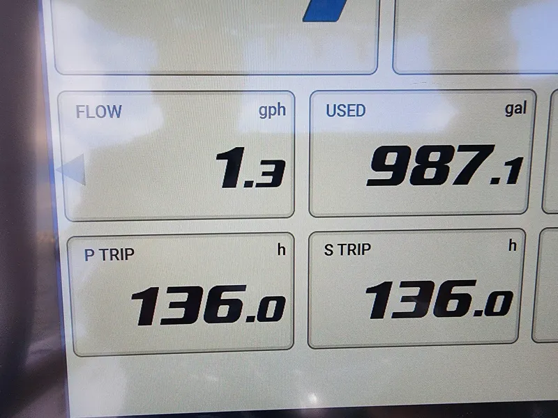 Slide: The Image of Dashboard display of 2024 Sea Hunt Ultra 275 SE showing fuel flow and trip hours. - 5
