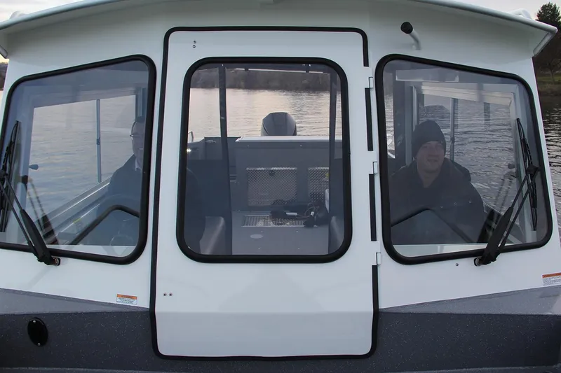 Slide: The Image of Interior of 2024 Spartan 220 Maximus boat with modern seating and dashboard. - 20