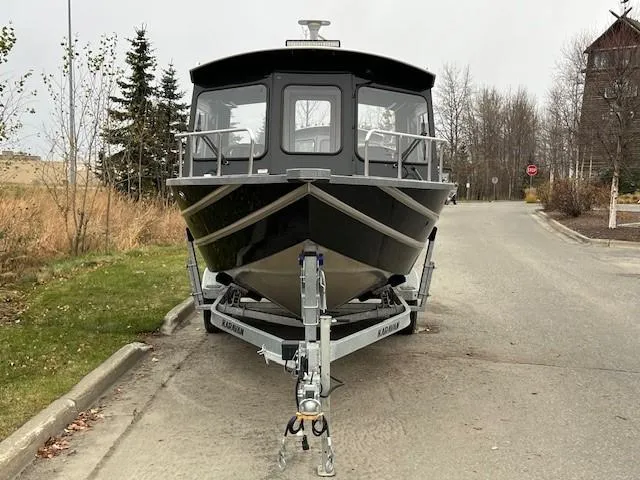 Slide: The Image of 2024 Spartan 220 Maximus boat on trailer, parked on street with autumn trees. - 5