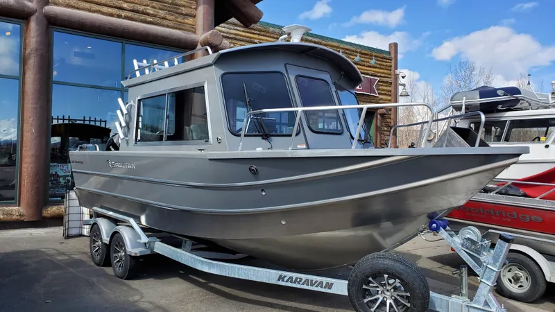 The Image of 2023 Spartan 220 Maximus boat on trailer, parked outdoors. - 0