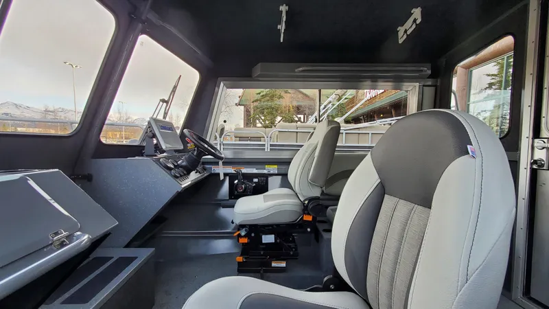 Slide: The Image of Interior of 2023 Spartan 220 Maximus with modern seating and control panel. - 35