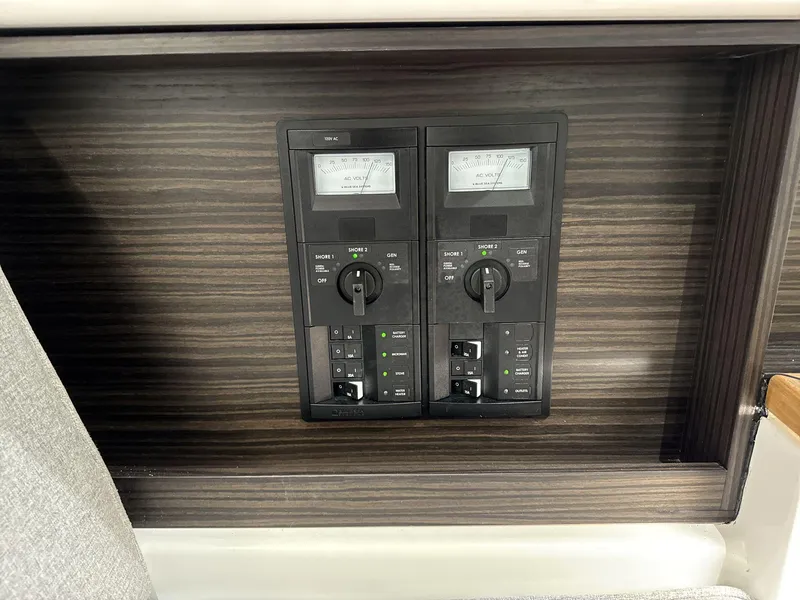 Slide: The Image of Control panel of 2025 Cobalt R35 boat with dual voltage meters. - 13