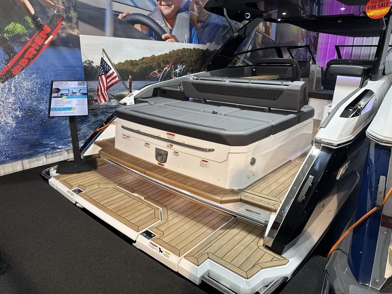 Slide: The Image of 2025 Cobalt R35 luxury boat with spacious deck and seating at a boat show. - 2