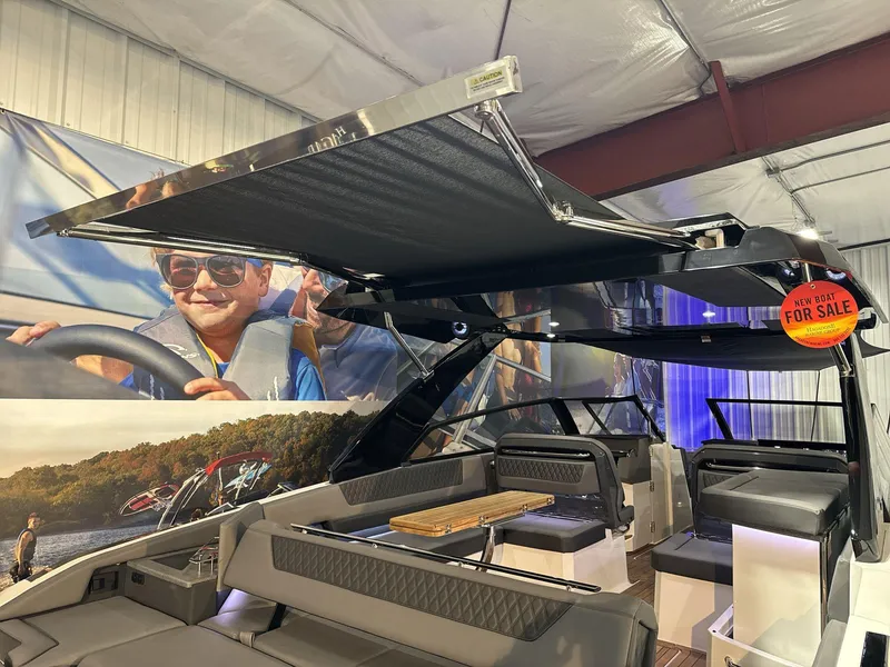 Slide: The Image of 2025 Cobalt R35 boat interior with retractable canopy, for sale sign visible. - 21