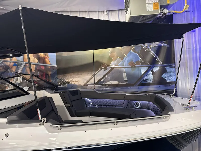 Slide: The Image of 2025 Cobalt R35 boat with black canopy and luxurious seating on display. - 22