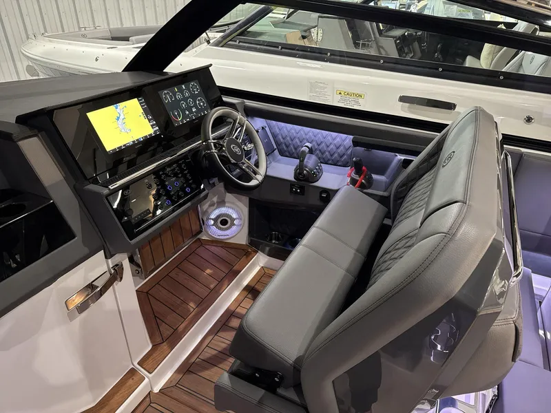 Slide: The Image of 2025 Cobalt R35 boat cockpit with modern controls and navigation screens. - 6