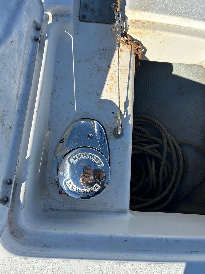 Slide: The Image of 1999 Silverton 351 Sedan Cruiser anchor winch and rope storage. - 14