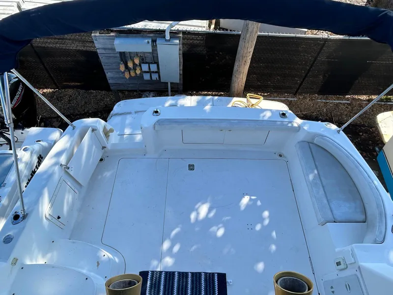 Slide: The Image of 1999 Silverton 351 Sedan Cruiser deck view with seating and canopy. - 15