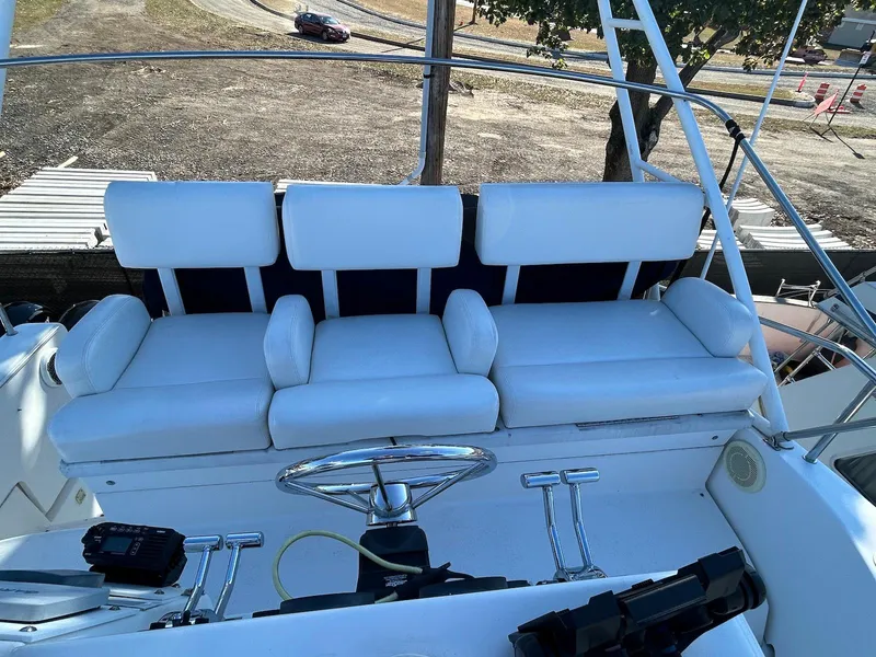 Slide: The Image of 1999 Silverton 351 Sedan Cruiser, white seating area, outdoor view. - 7