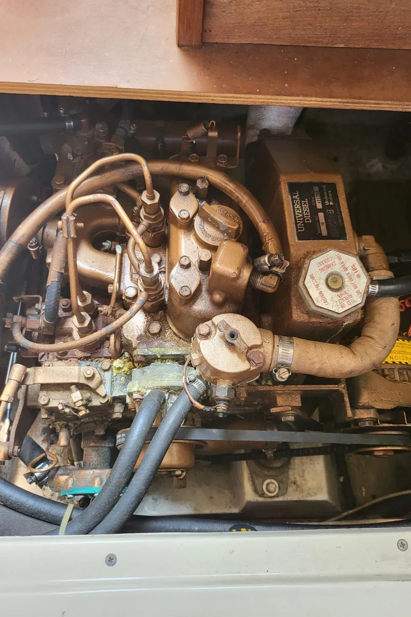 Slide: The Image of Engine of a 1988 Catalina 30 boat, close-up view. - 17