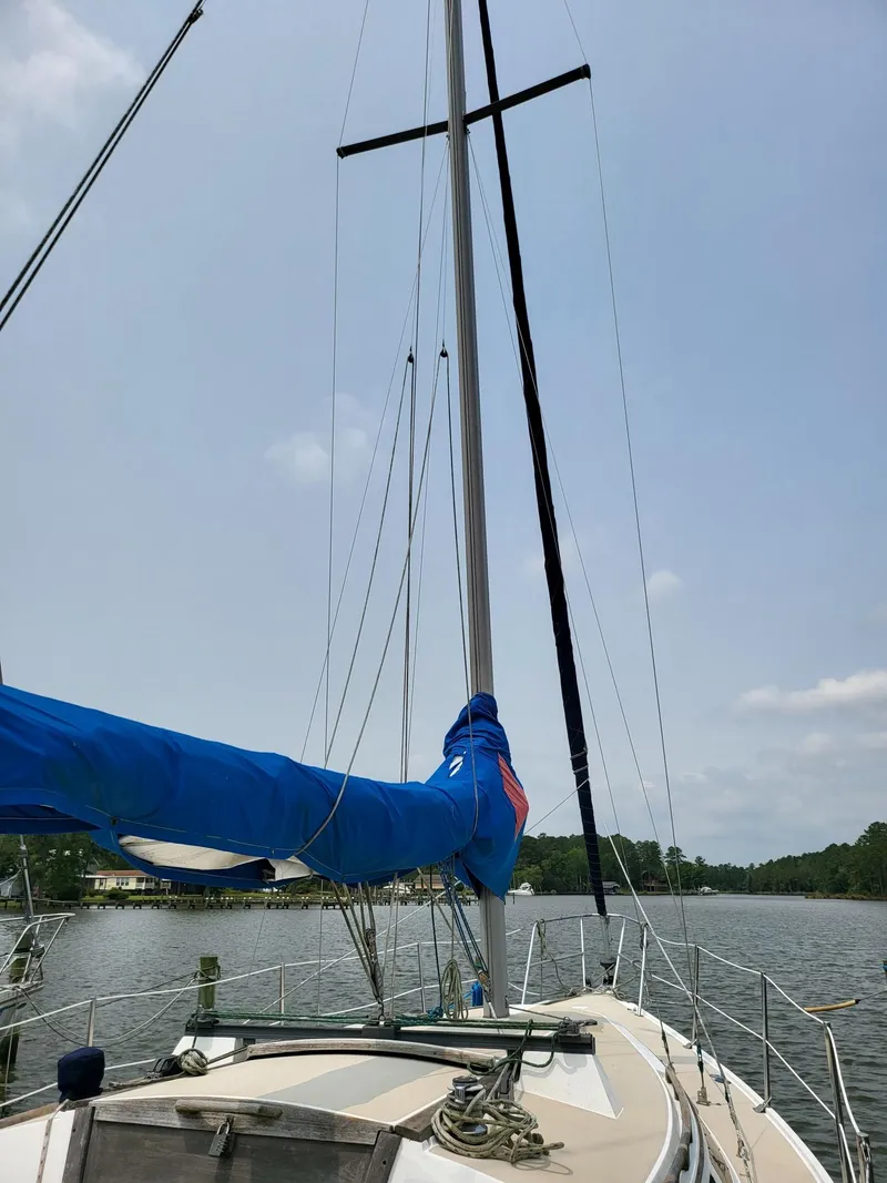 Slide: The Image of 1988 Catalina 30 sailboat on calm water. - 5