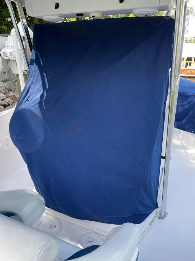 Slide: The Image of 2004 Donzi 35 ZF Open boat with blue cover, interior view. - 12