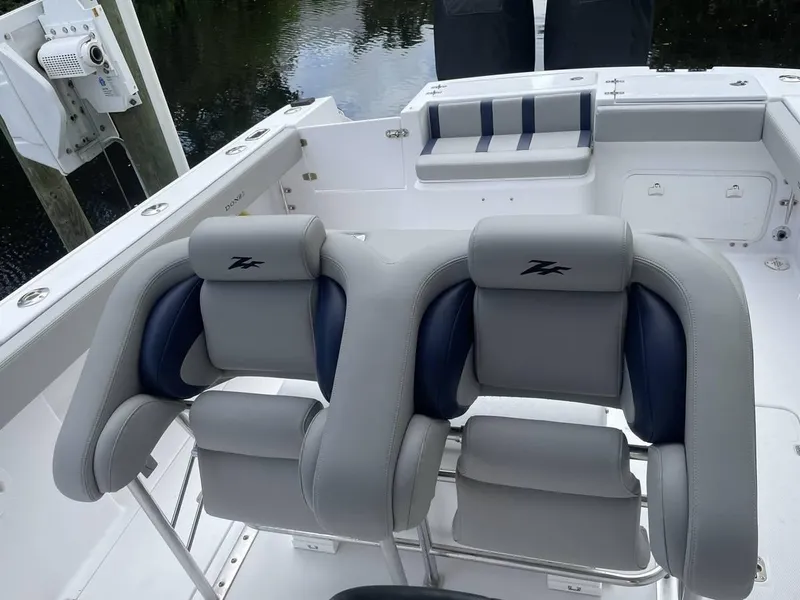 Slide: The Image of 2004 Donzi 35 ZF Open boat interior with cushioned seating and sleek design. - 19