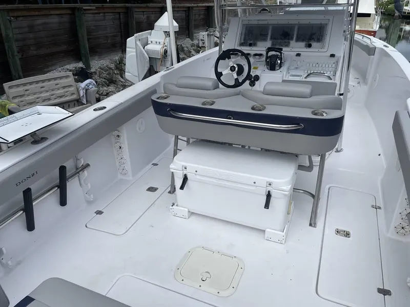 Slide: The Image of 2004 Donzi 35 ZF Open boat interior with helm and seating area. - 20