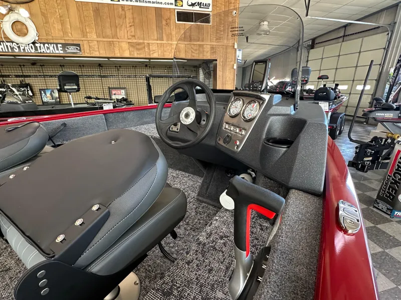 Slide: The Image of 2025 Tracker Pro Guide V-16 SC boat interior with steering wheel and dashboard controls. - 7