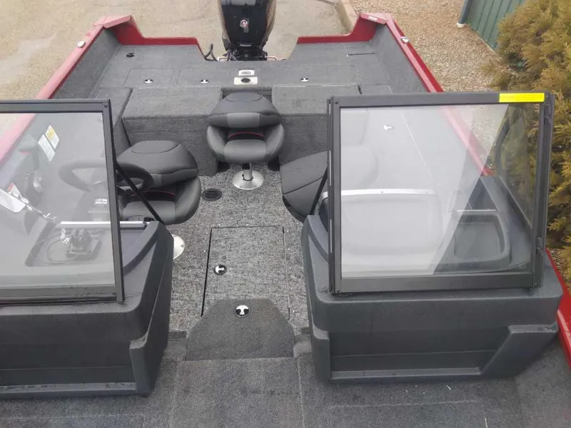 Slide: The Image of 2025 Tracker Pro Guide V-175 Combo boat interior with seating and windshield. - 2