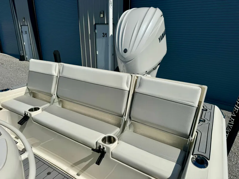 Slide: The Image of 2022 ShearWater 260 Carolina Flair boat seating with Yamaha engine in storage facility. - 10