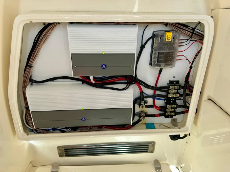Slide: The Image of Electrical panel of 2022 ShearWater 260 Carolina Flair boat, featuring wiring and components. - 11