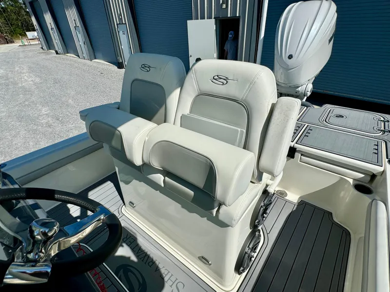 Slide: The Image of 2022 ShearWater 260 Carolina Flair boat seats and helm, featuring modern design and comfort. - 14