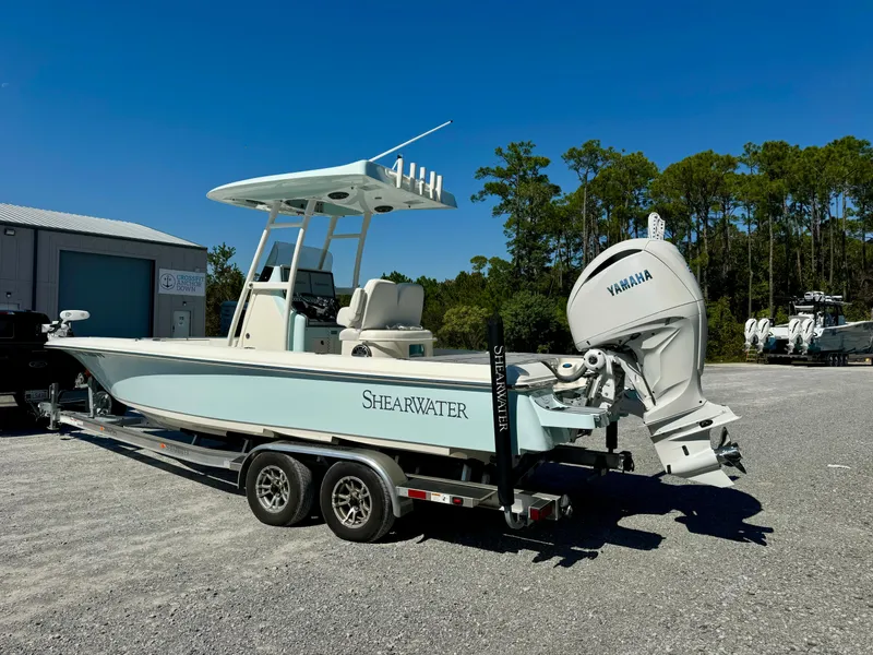 Slide: The Image of 2022 ShearWater 260 Carolina Flair boat with Yamaha engine on trailer. - 3