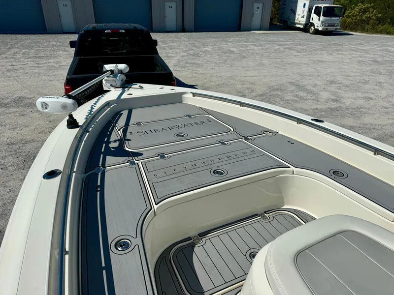 Slide: The Image of 2022 ShearWater 260 Carolina Flair boat on trailer, parked in storage area. - 6