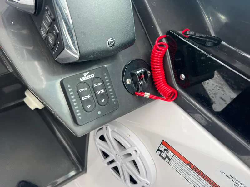 Slide: The Image of Control panel of 2024 Blackfin 272 DC boat with Lenco trim tab switches. - 1