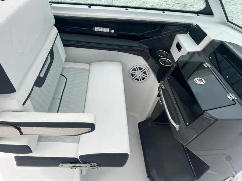 Slide: The Image of 2024 Blackfin 272 DC boat interior with seating and console, featuring modern design and amenities. - 13