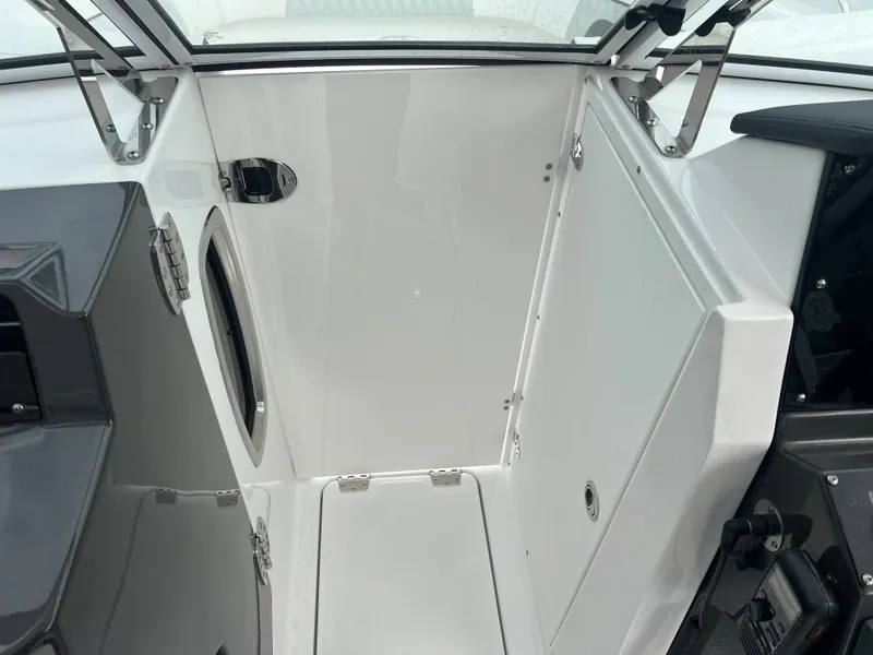 Slide: The Image of 2024 Blackfin 272 DC boat interior, featuring sleek white design and modern fixtures. - 17