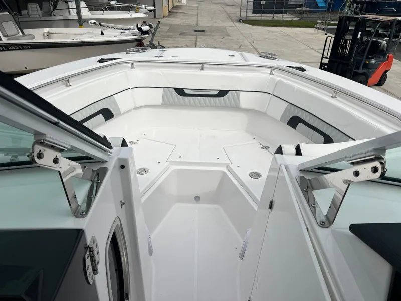 Slide: The Image of 2024 Blackfin 272 DC boat interior, featuring spacious seating and sleek design. - 19