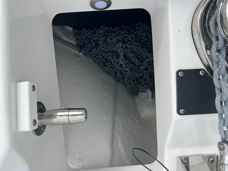 Slide: The Image of 2024 Blackfin 272 DC boat anchor compartment with chain and winch. - 26