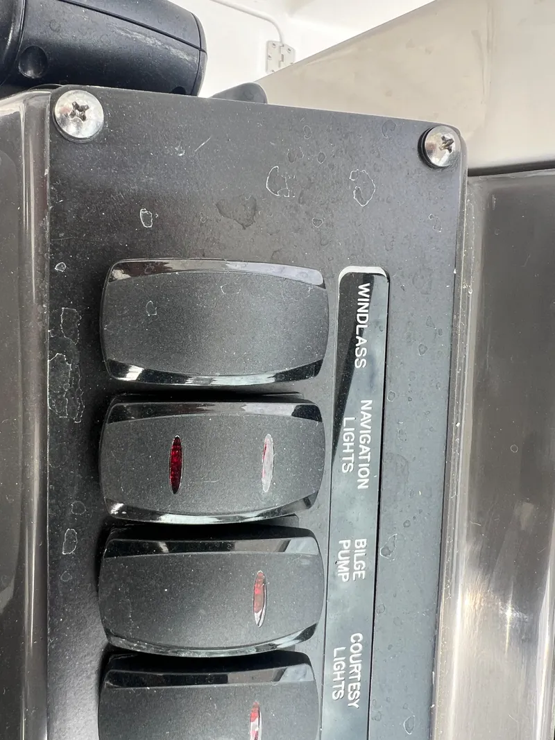 Slide: The Image of Control panel of 2024 Blackfin 272 DC boat with labeled switches. - 30