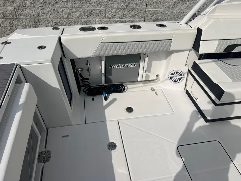 Slide: The Image of 2024 Blackfin 272 DC boat interior with seating and storage compartments. - 39