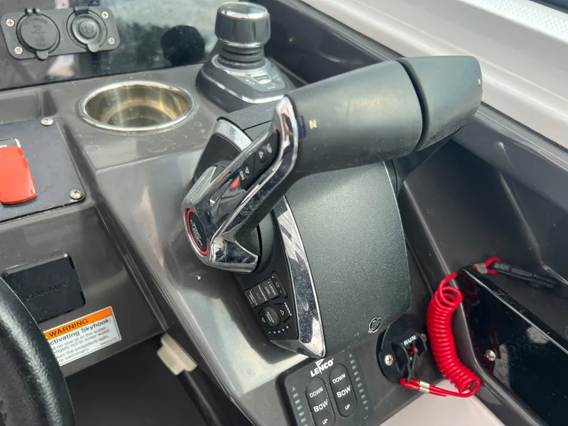 Slide: The Image of 2024 Blackfin 272 DC boat throttle control and dashboard details. - 4