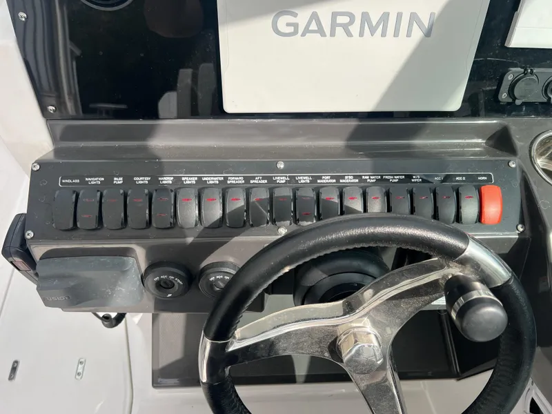 Slide: The Image of 2024 Blackfin 272 DC dashboard with Garmin display and steering wheel. - 9