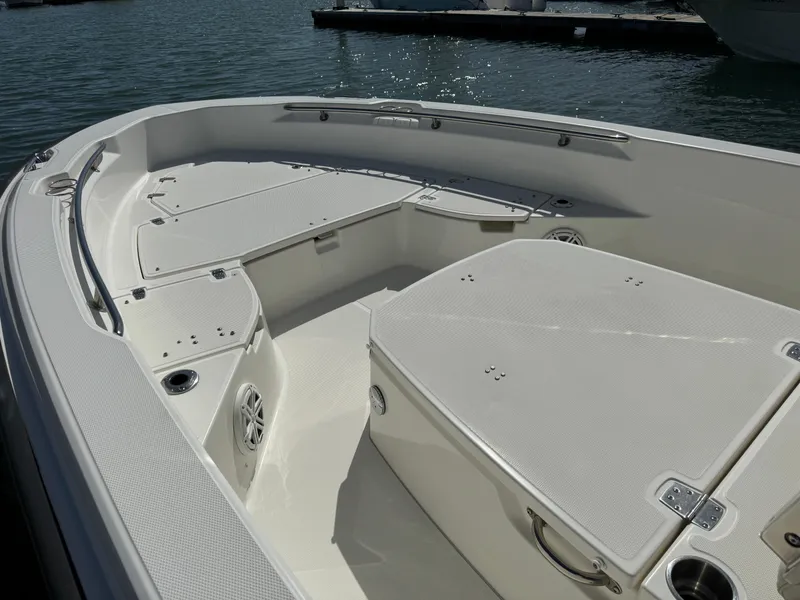 Slide: The Image of 2022 Boston Whaler 250 Dauntless boat interior, featuring spacious seating and storage compartments. - 11