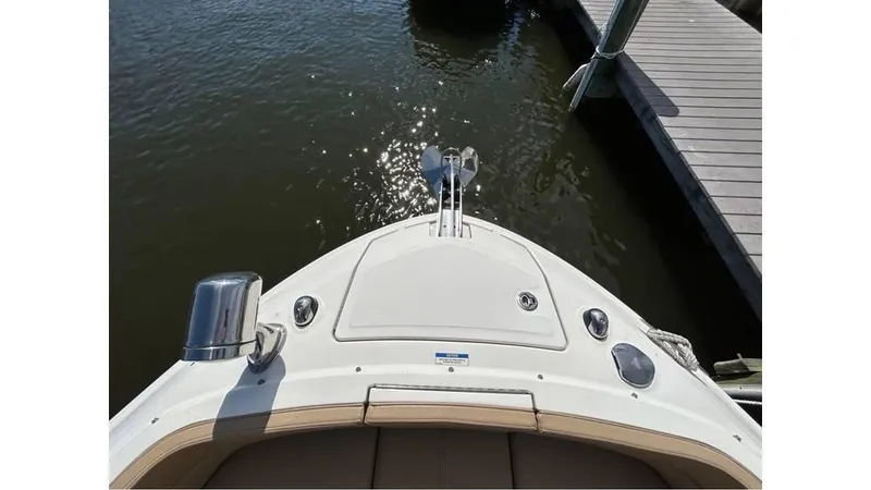 Slide: The Image of 2019 Sea Ray 310 SLX boat bow at dock, sunny day. - 18