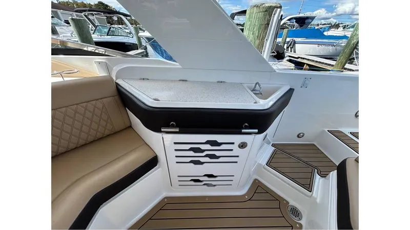 Slide: The Image of 2019 Sea Ray 310 SLX boat interior with seating and storage. - 7
