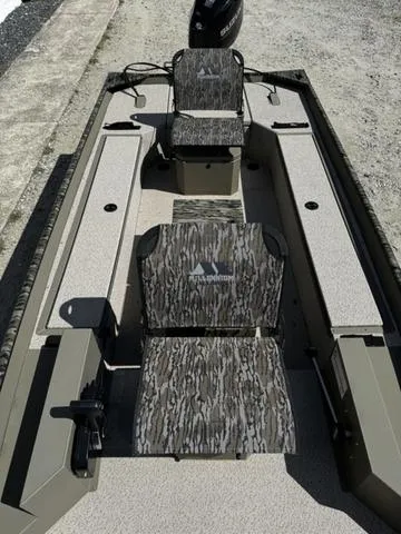 Slide: The Image of 2024 SeaArk 31652 CRAPPIE boat with camouflage seating and spacious interior design. - 10