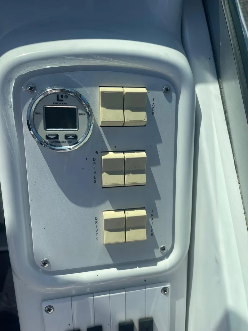 Slide: The Image of Control panel of 1998 Formula 312FASTECH boat with switches and gauge. - 14