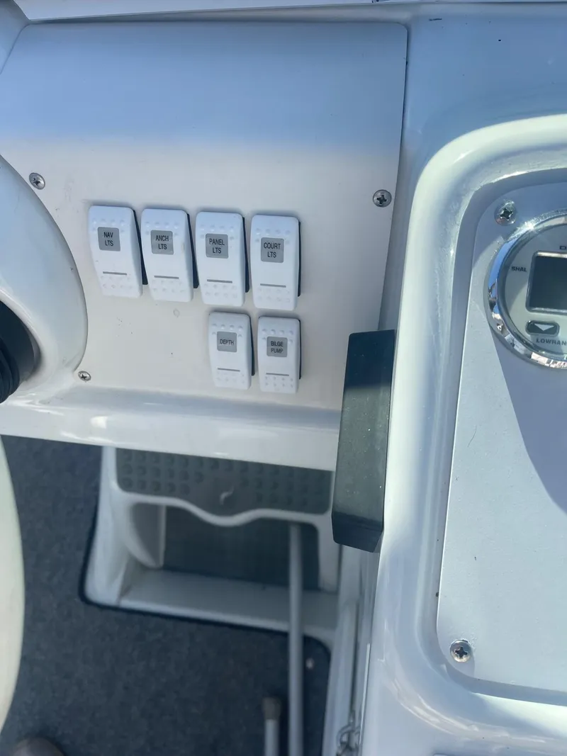 Slide: The Image of Control panel of a 1998 Formula 312FASTECH boat with switches and gauge. - 16