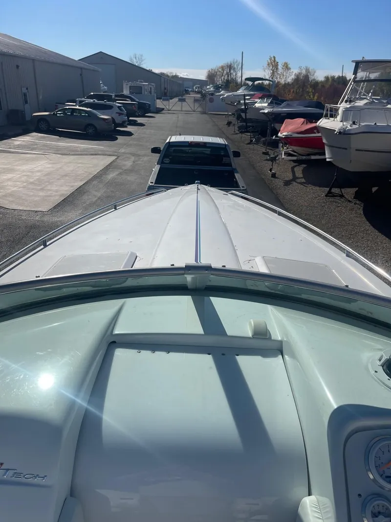 Slide: The Image of 1998 Formula 312FASTECH boat on trailer in marina parking lot. - 29