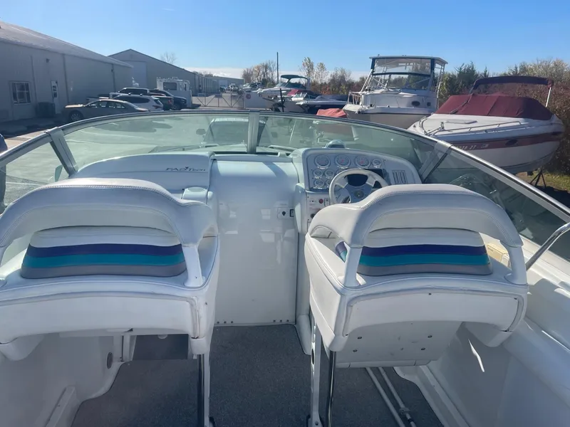 Slide: The Image of Interior view of a 1998 Formula 312FASTECH speedboat with dual white seats and dashboard. - 6