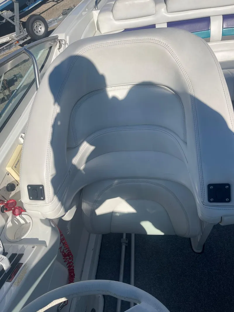 Slide: The Image of 1998 Formula 312FASTECH boat seat with white upholstery and shadow. - 9