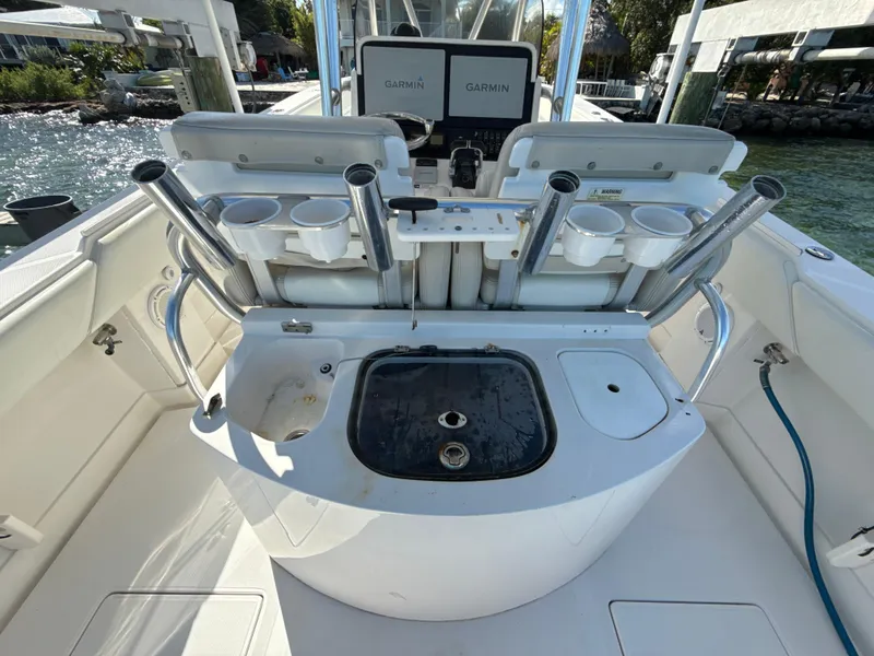 Slide: The Image of 2008 Jupiter 38 boat cockpit with fishing rod holders and Garmin navigation system. - 10