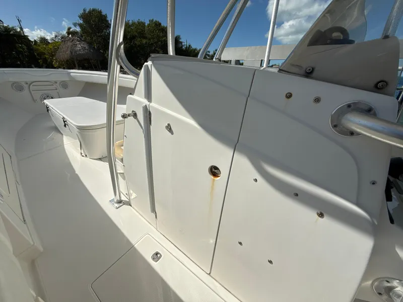 Slide: The Image of 2008 Jupiter 38 boat interior with white seating and storage compartments. - 22