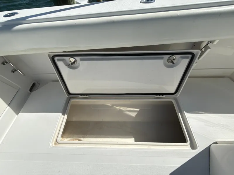 Slide: The Image of Open storage compartment on a 2008 Jupiter 38 boat deck. - 27