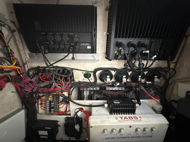 Slide: The Image of Electrical system of a 2008 Jupiter 38 boat with wiring and battery components. - 29