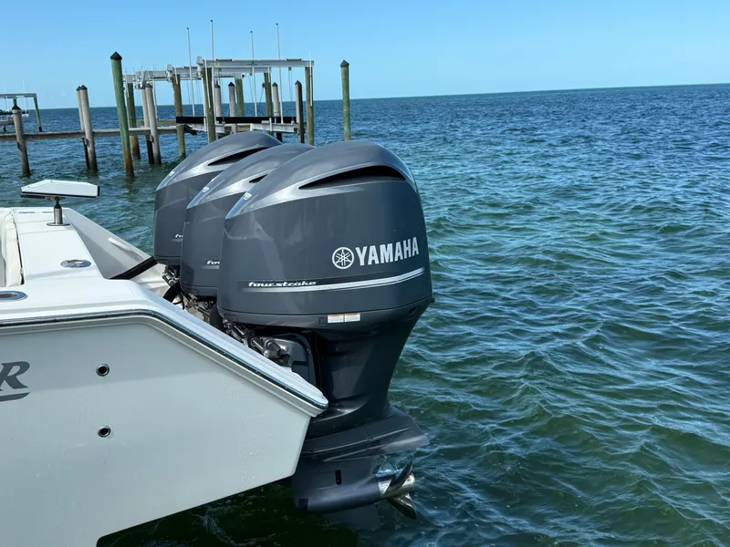 Slide: The Image of 2008 Jupiter 38 boat with Yamaha outboard motors on the water. - 4